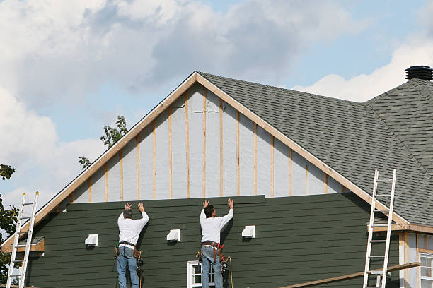 Professional Siding Installation technician working in East Walpole, MA